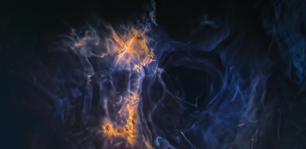 Liquid shapes and colors are mixing together