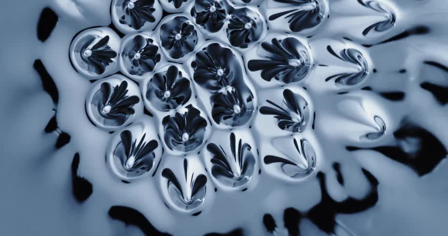 Black shiny liquid forming a textured surface