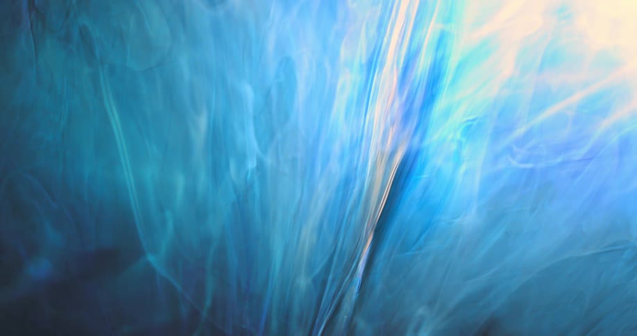 Strands of colorful blue electric bright smoke slowly flowing down
