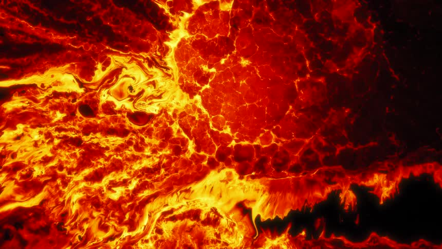 Yellow and red bright flames flow and converge like lava over a black background