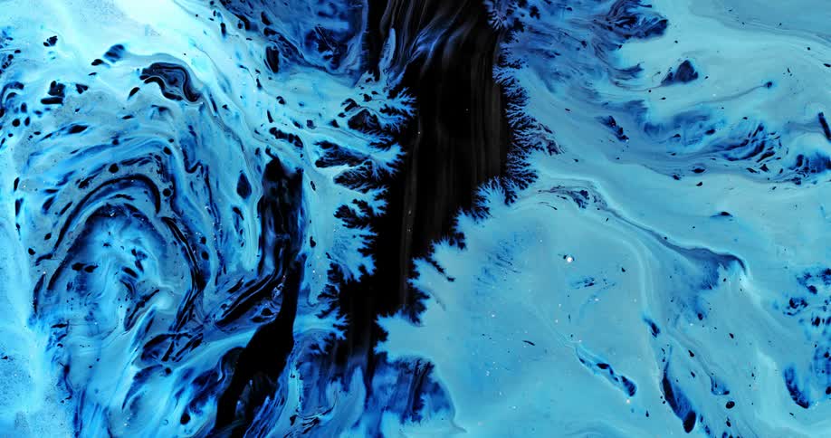 Bright electric blue luminous ink clouds flowing down on a black background