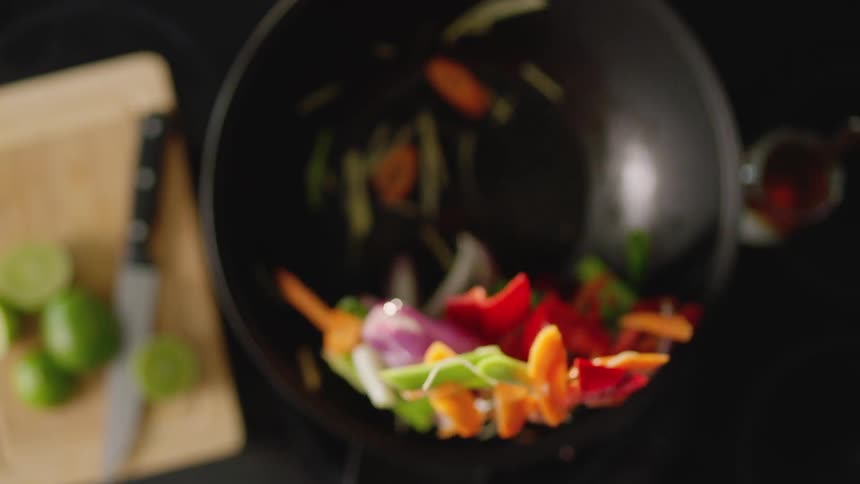 Vegetables are being cooked in the pan