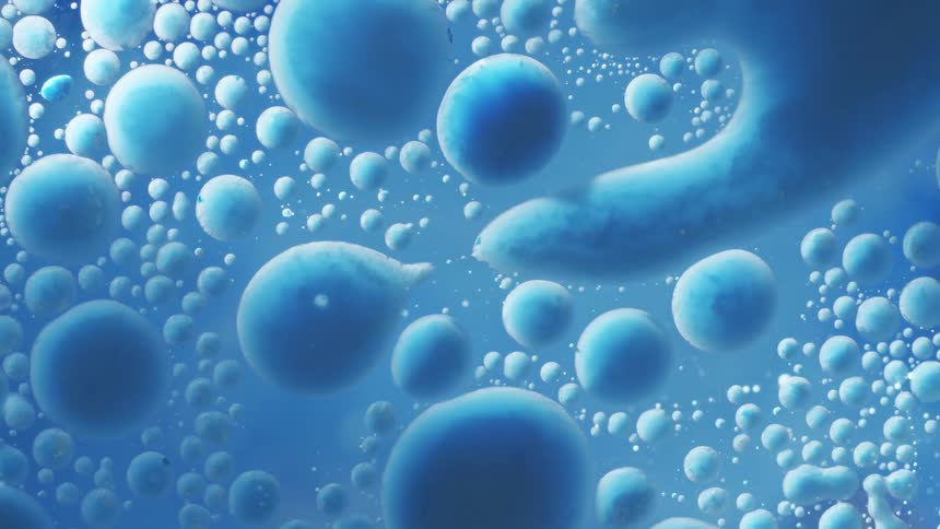 Blue droplets suspended in liquid