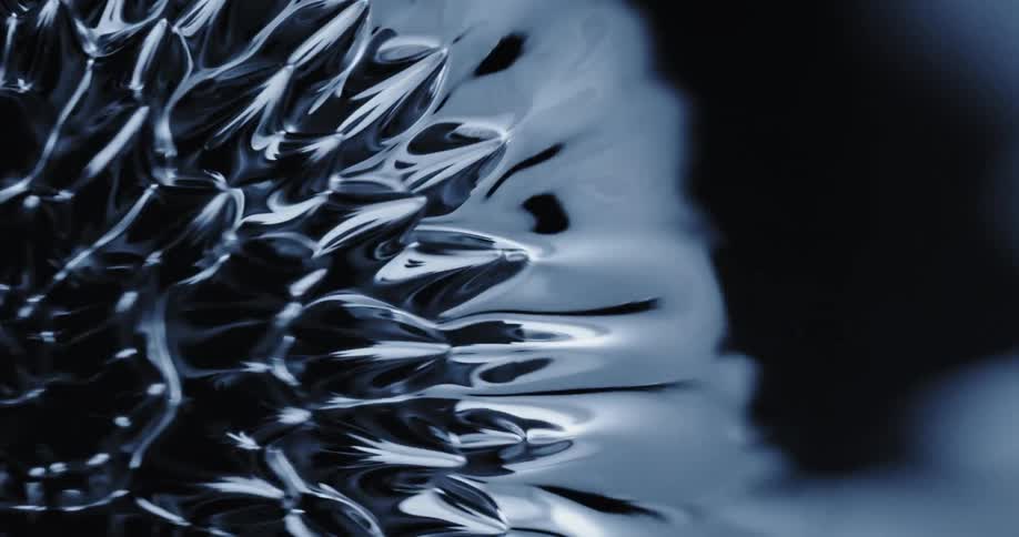 Rippling shiny black liquid