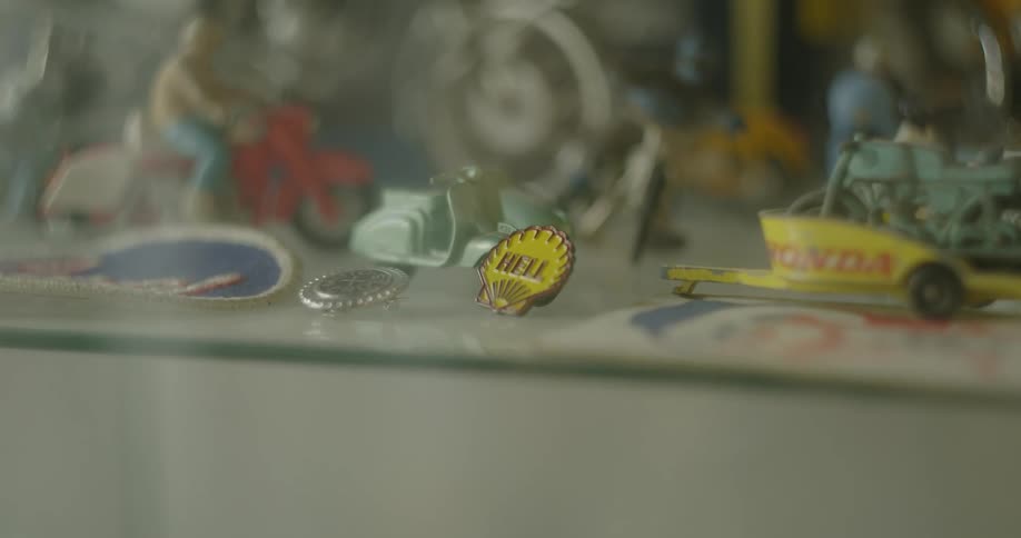 Vintage toys and assorted sundries over a shelf