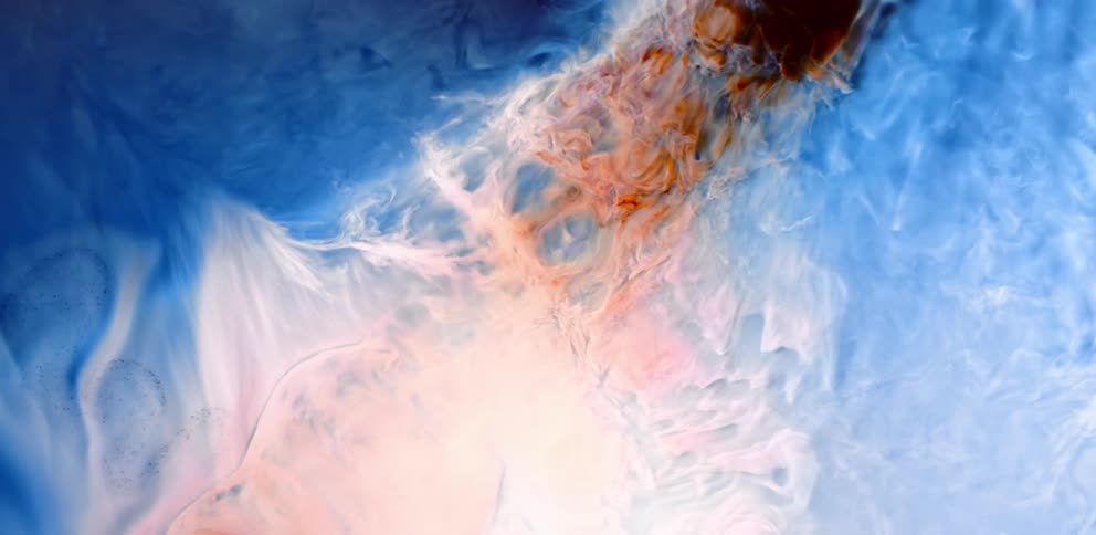 Flowing and swirling blue and orange liquid