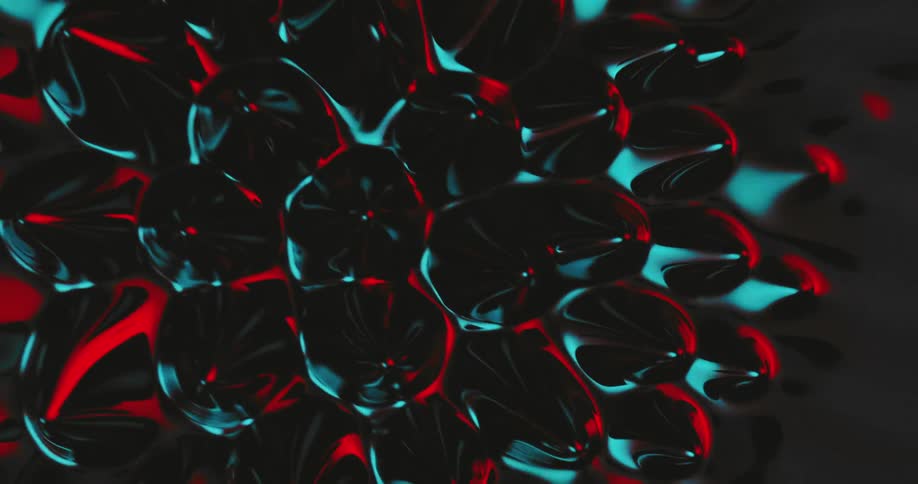 Black red and blue bubbles form and spread then enlarge against ad dark gray background