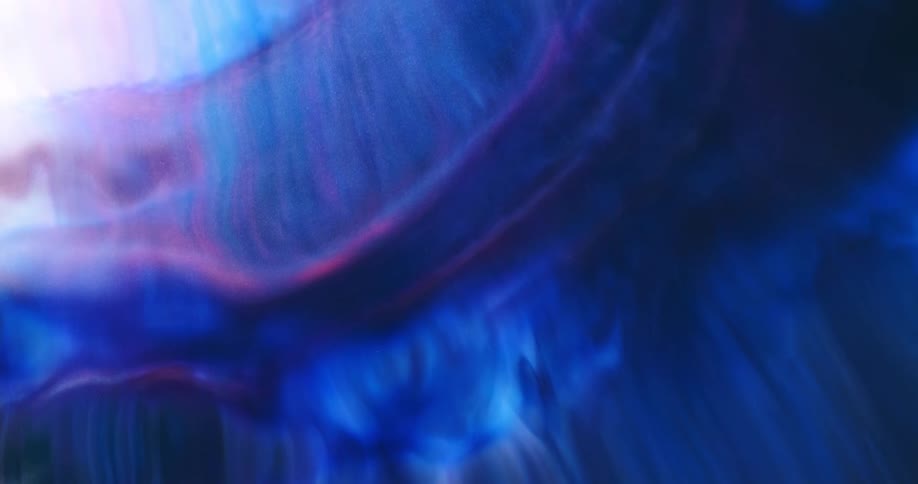 Abstract rippling purple and blue liquid