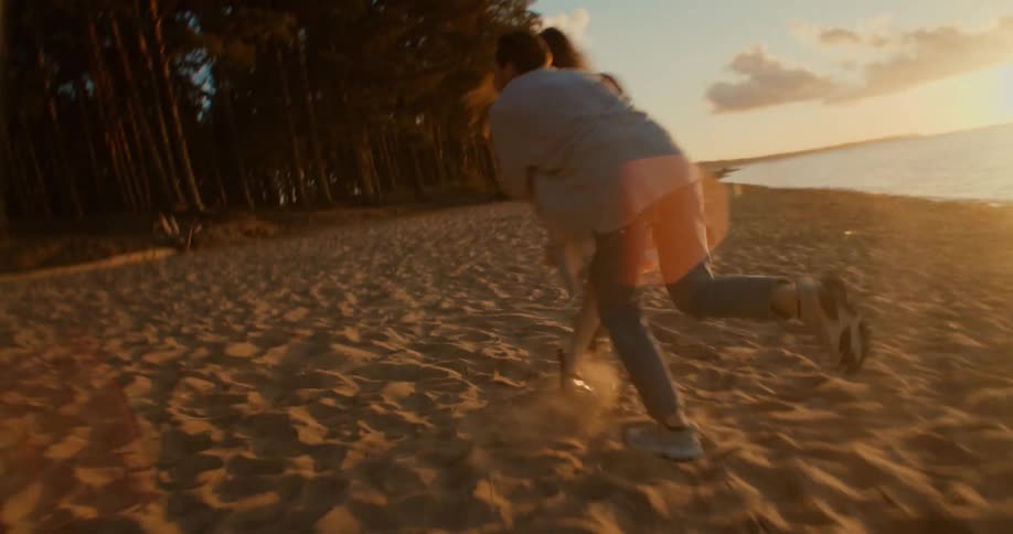 A man and woman playing and running