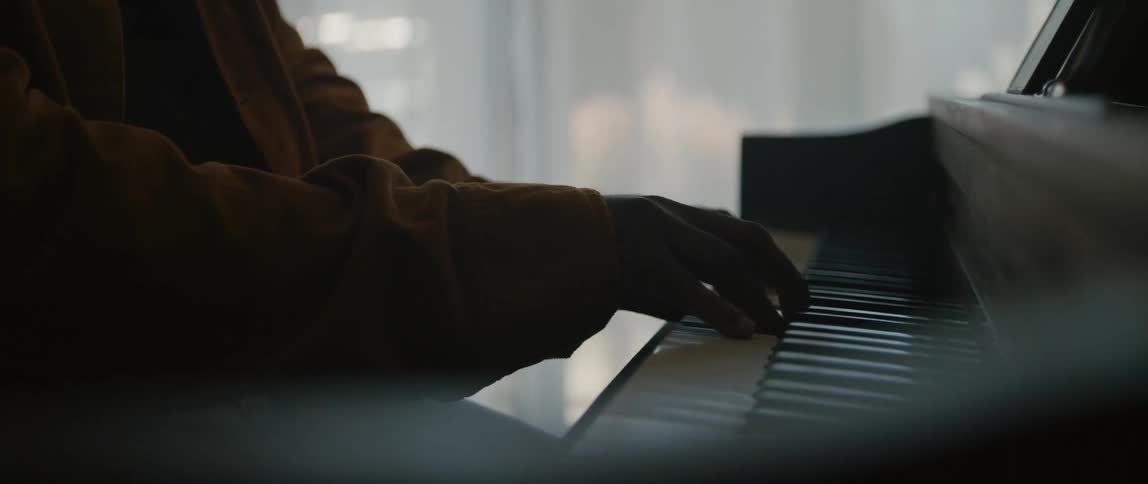 A person is playing the piano