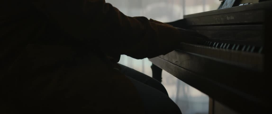 A view of a man playing piano