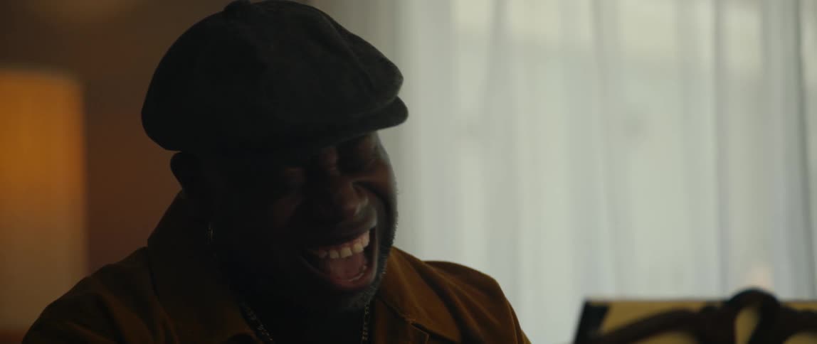 A man playing piano in a room