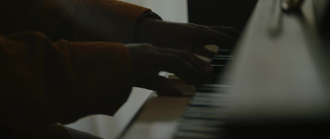 A person is playing the piano