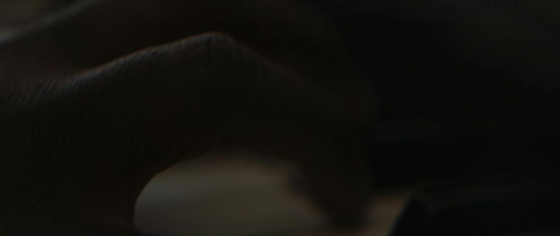 A hand playing piano