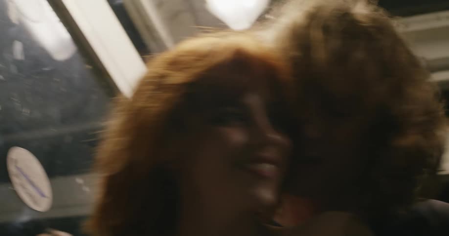 A couple dance and kiss