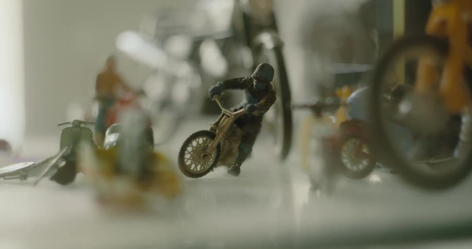 A collection of motorcycle and rider figurines on display