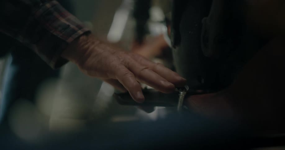 A person is fixing a wheel on a bicycle