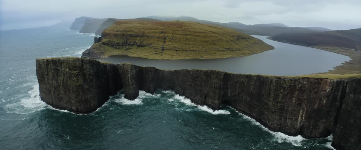 A cliff is on the shore
