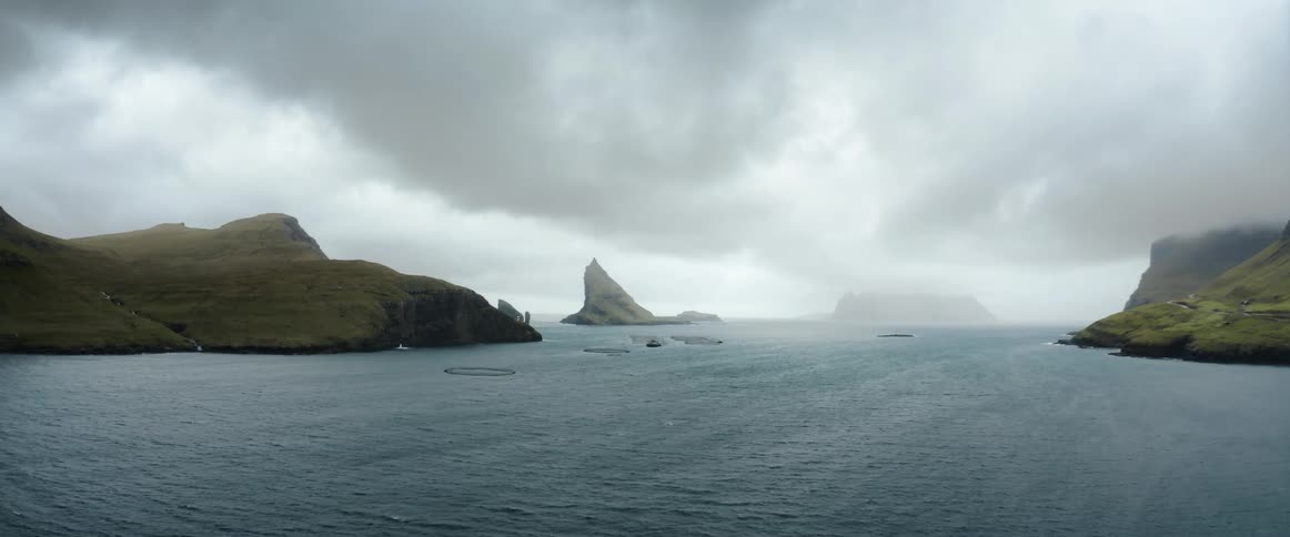 A view of the ocean and wide open landscape is displayed