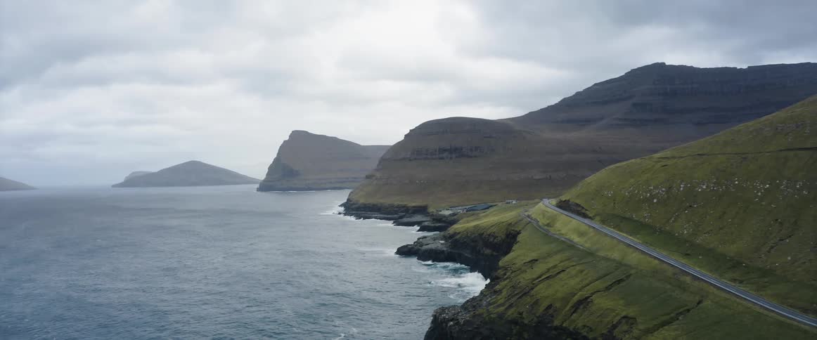 Aerial view of a road on the slope of a mountain in the coast