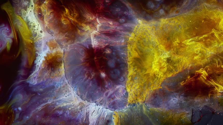 Blobs of bright colorful inks in chaotic patterns