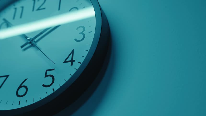 Close up view of time ticking on a clock on a wall