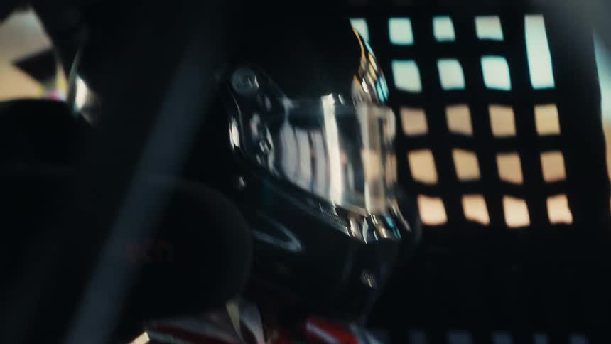 A person is racing a race car