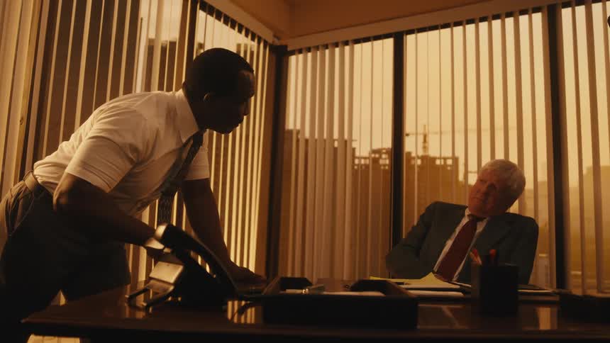 Two employees are talking to eachother in their office