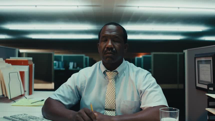 An office worker closes his eyes