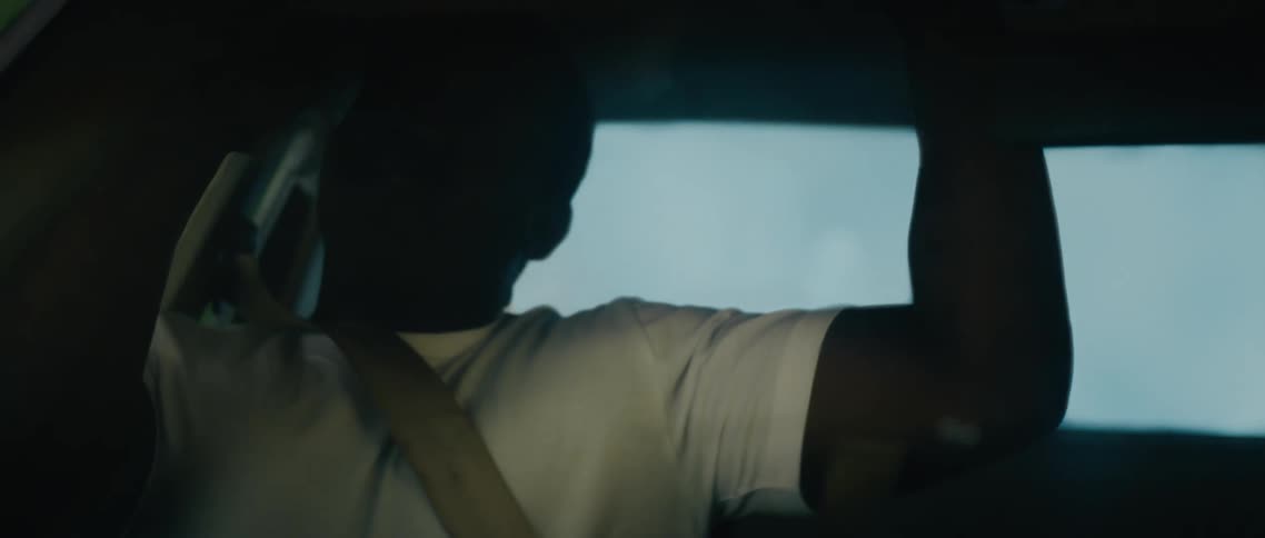 A car wreck has a man crashing around the car