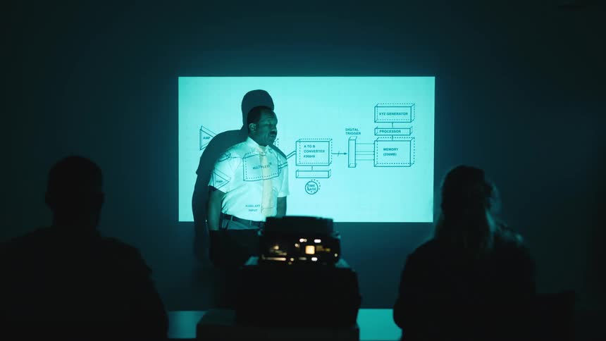 A man is giving a presentation with a projector