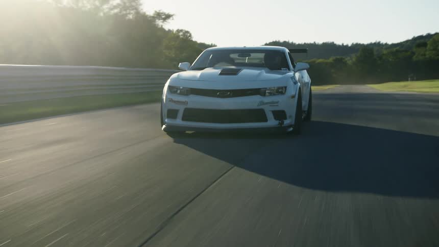 The car is speeding on the track
