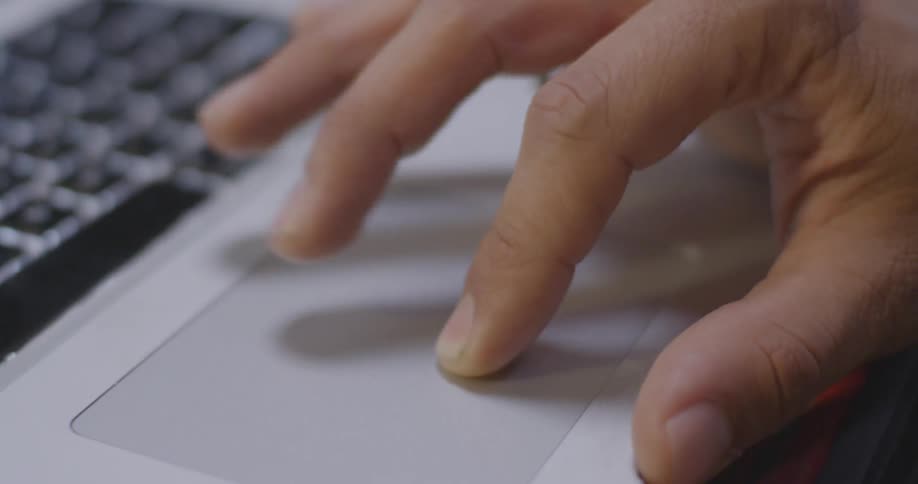 A person uses the touchscreen of a laptop
