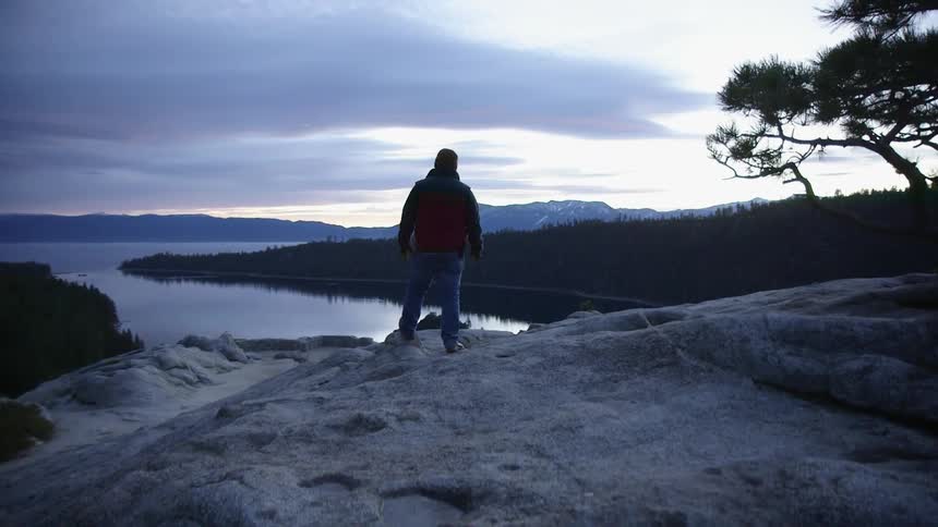 A man hikes on a rocky area
