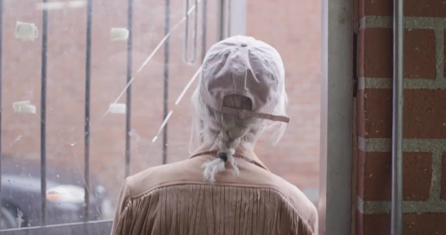 A woman walks out of a building
