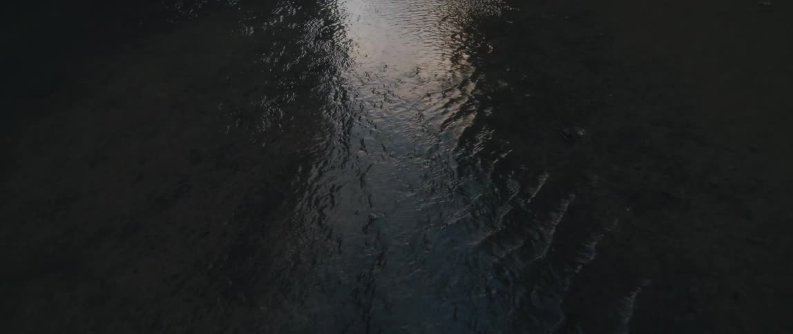 Water rippling over the ground in nature