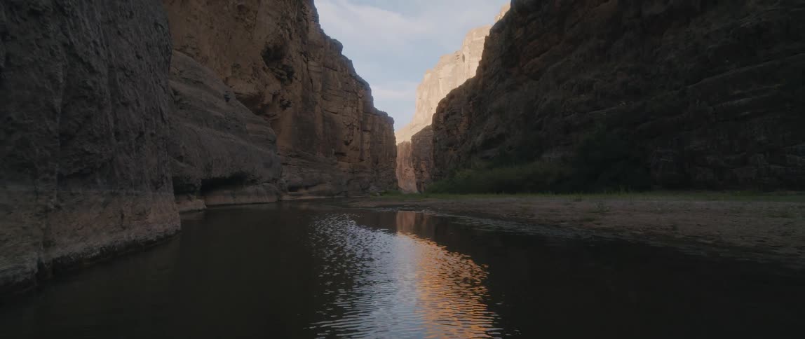 A view of a canyon from a river