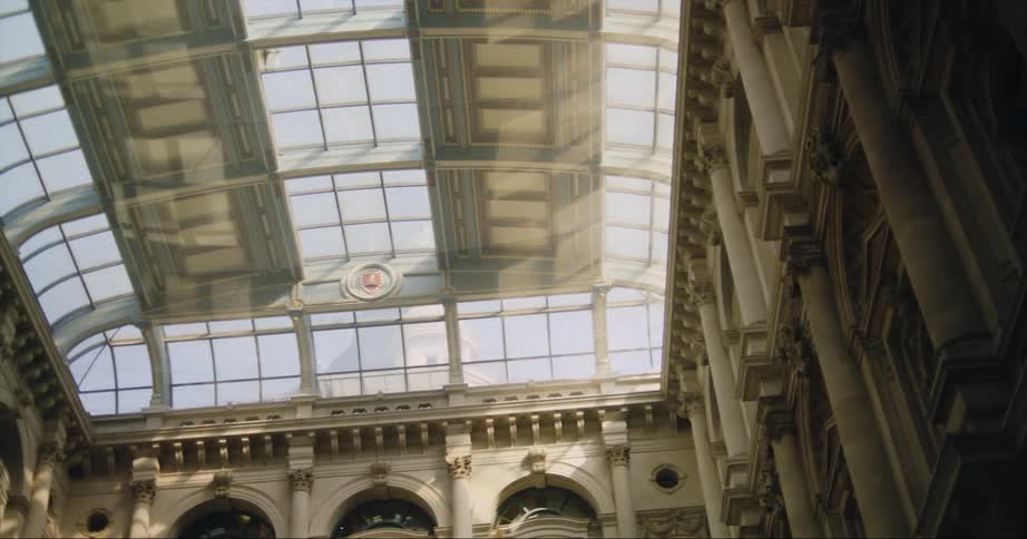 Panning footage of a large skylight ceiling on a building