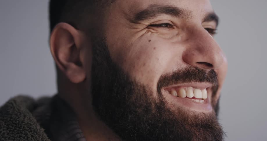 A man giving a wide smile