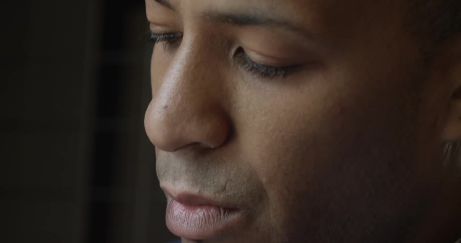 A man is looking down at something