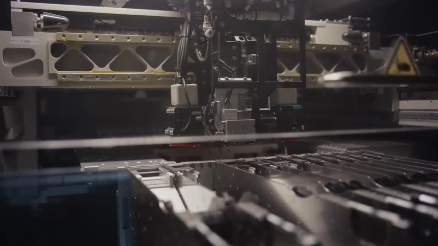 Machine attached to ceiling flows across factory area