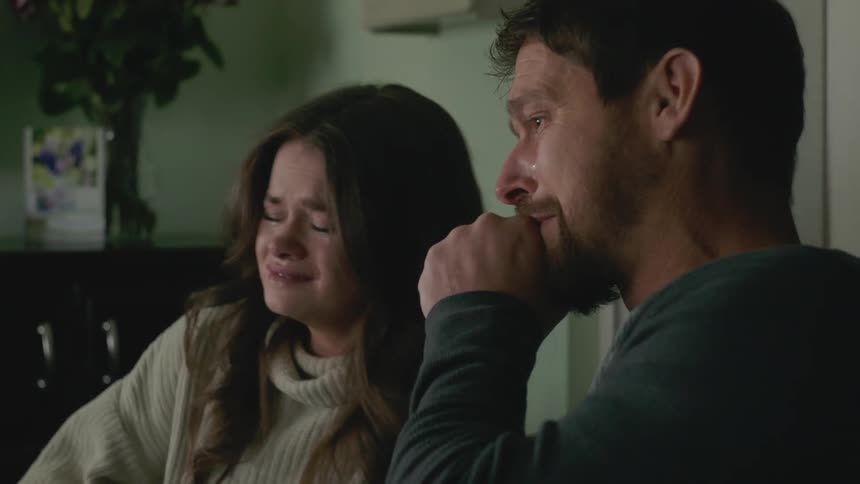 Couple receive bad news and hold each other and cry