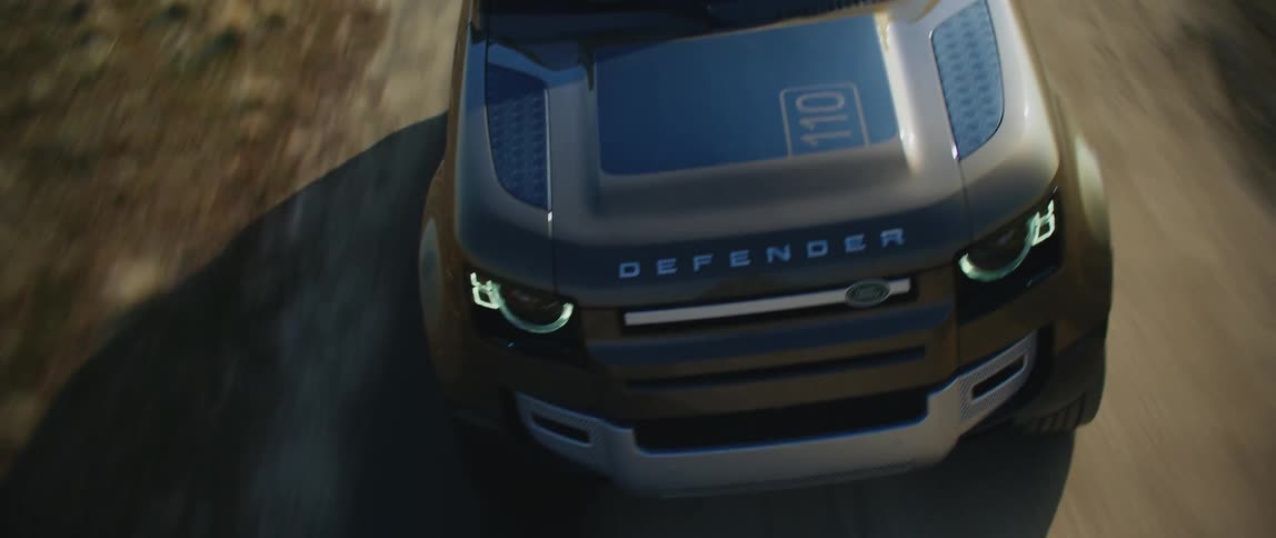 A vehicle speeding down a dirt road