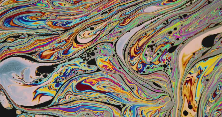 Liquid colors are mixing together in a pattern