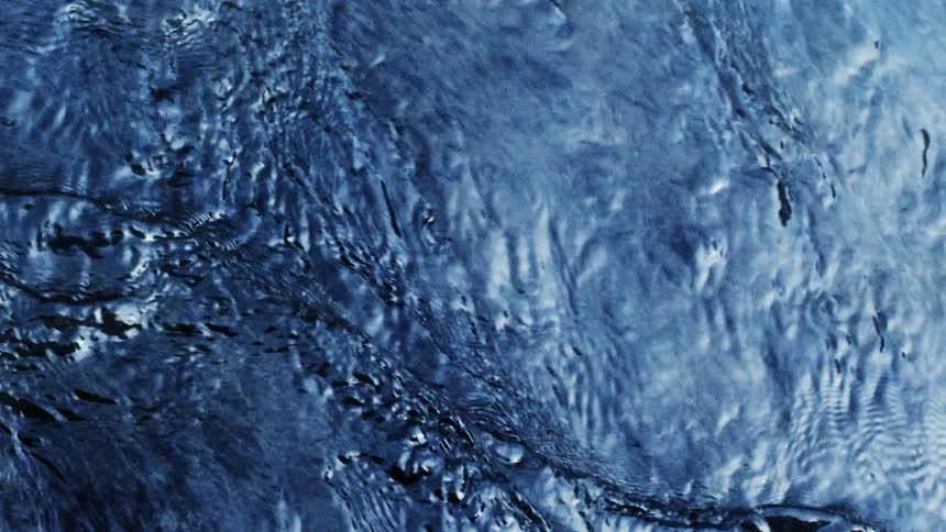 Ripples on the surface of a body of water during the day