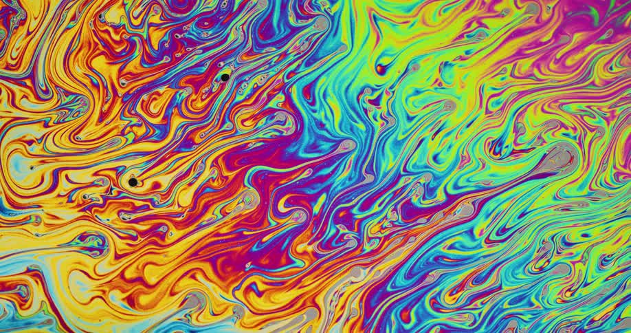 Bright colors are moving and exploring other parts of the canvas in a psychedelic manner