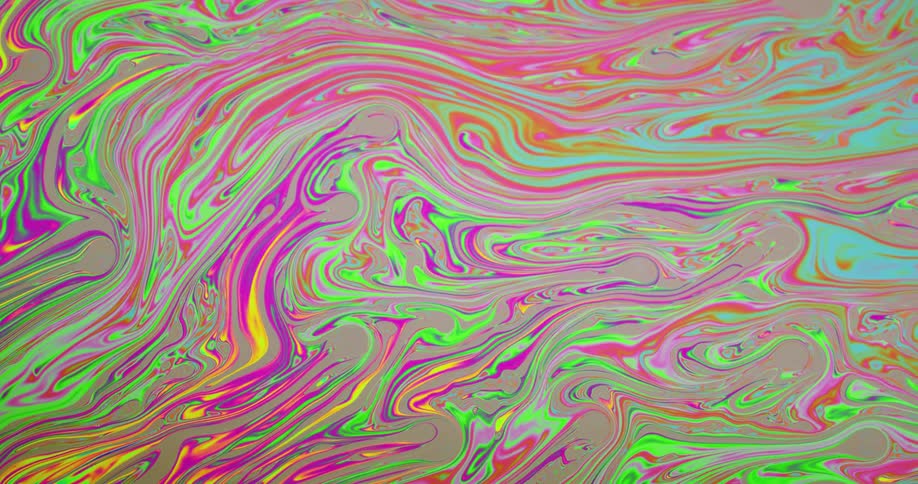 Multiple colors of fluid are coming together and pushing creating swirls