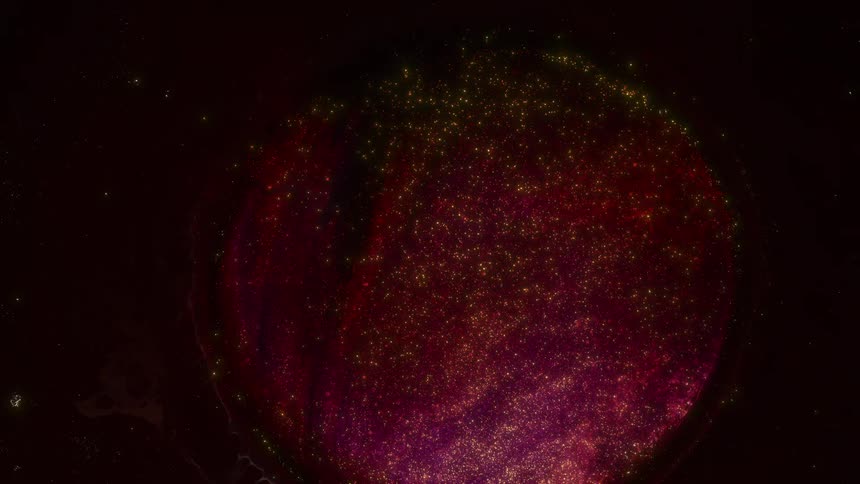 Substance with included particles expands and spreads forming growing circle against a darker background