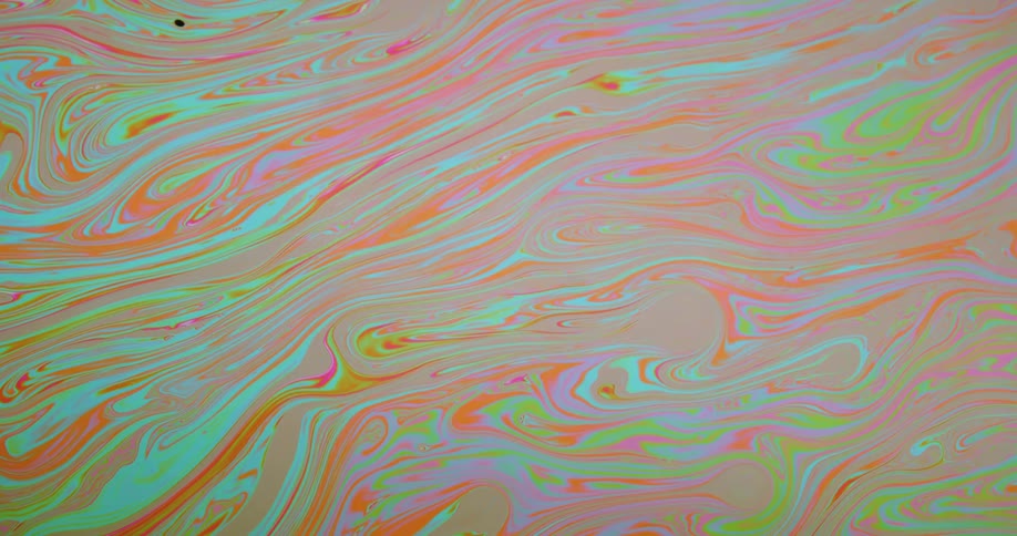 Neon colors blend and swirl together using graphic software