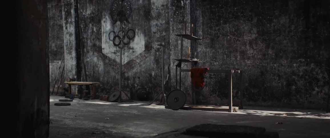 An old olympic venue is fallen into disrepair and is very dirty